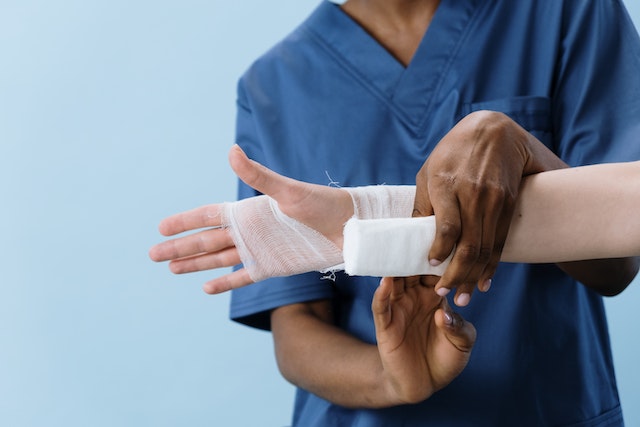 doctor wrapping someone's hand